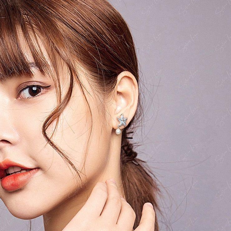 Blue starfish pearl drop sterling silver earrings