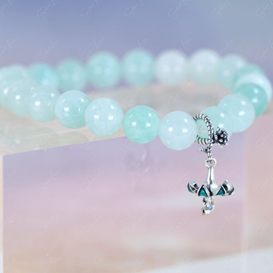 green beaded bracelet with bell flower charm