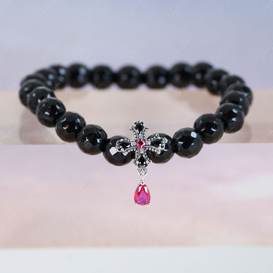Black agate beaded bracelet with black cross charm