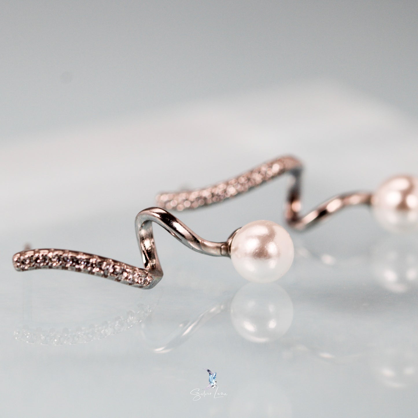 Wavy pearl sterling silver stud earrings