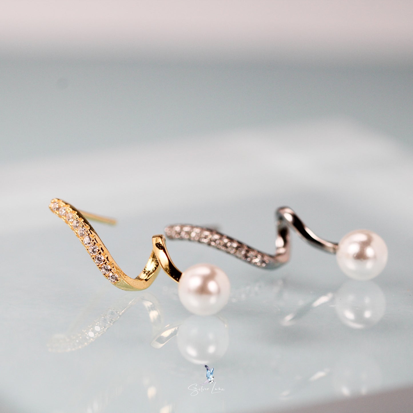 Wavy pearl sterling silver stud earrings