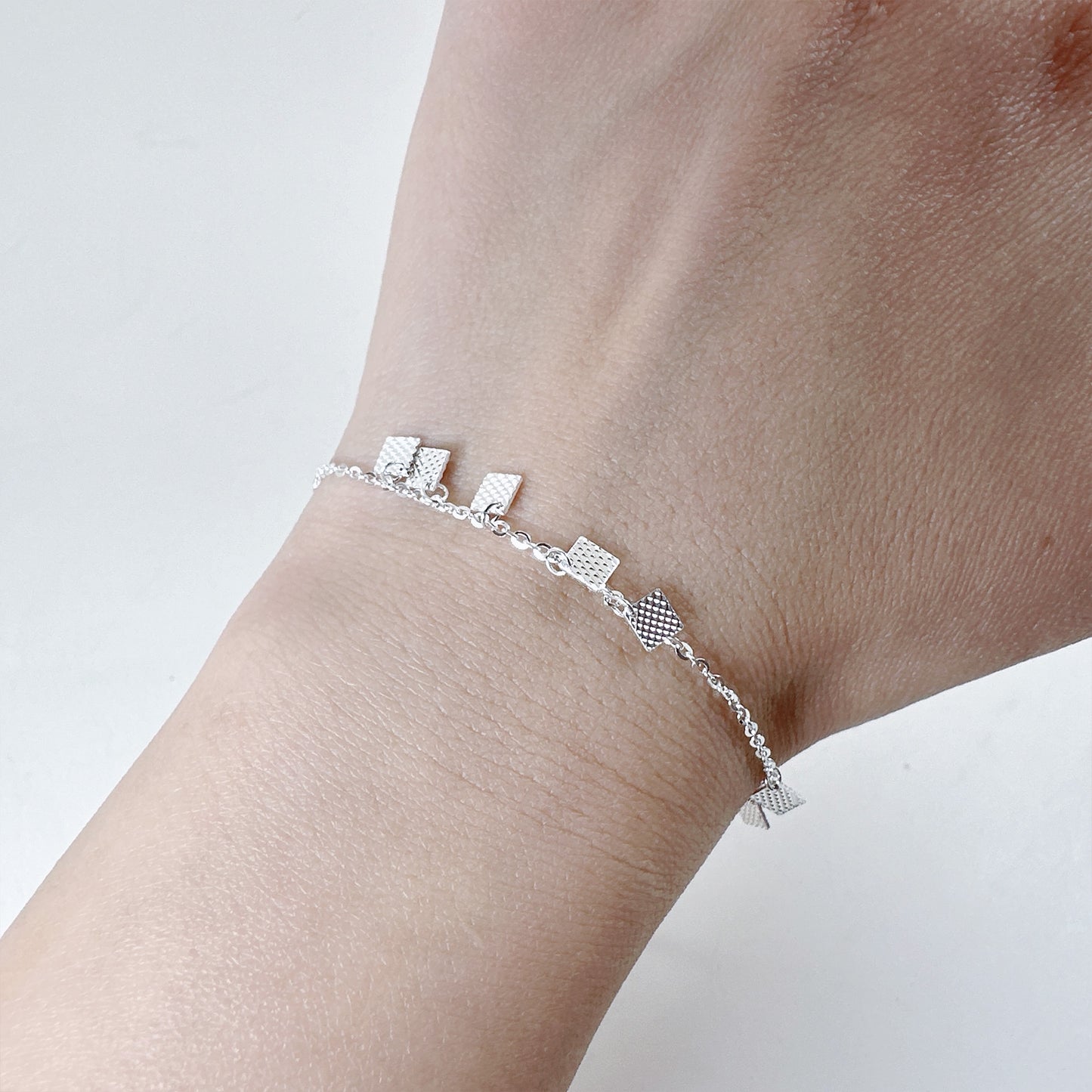 Geometric texture square charms bracelet in sterling silver