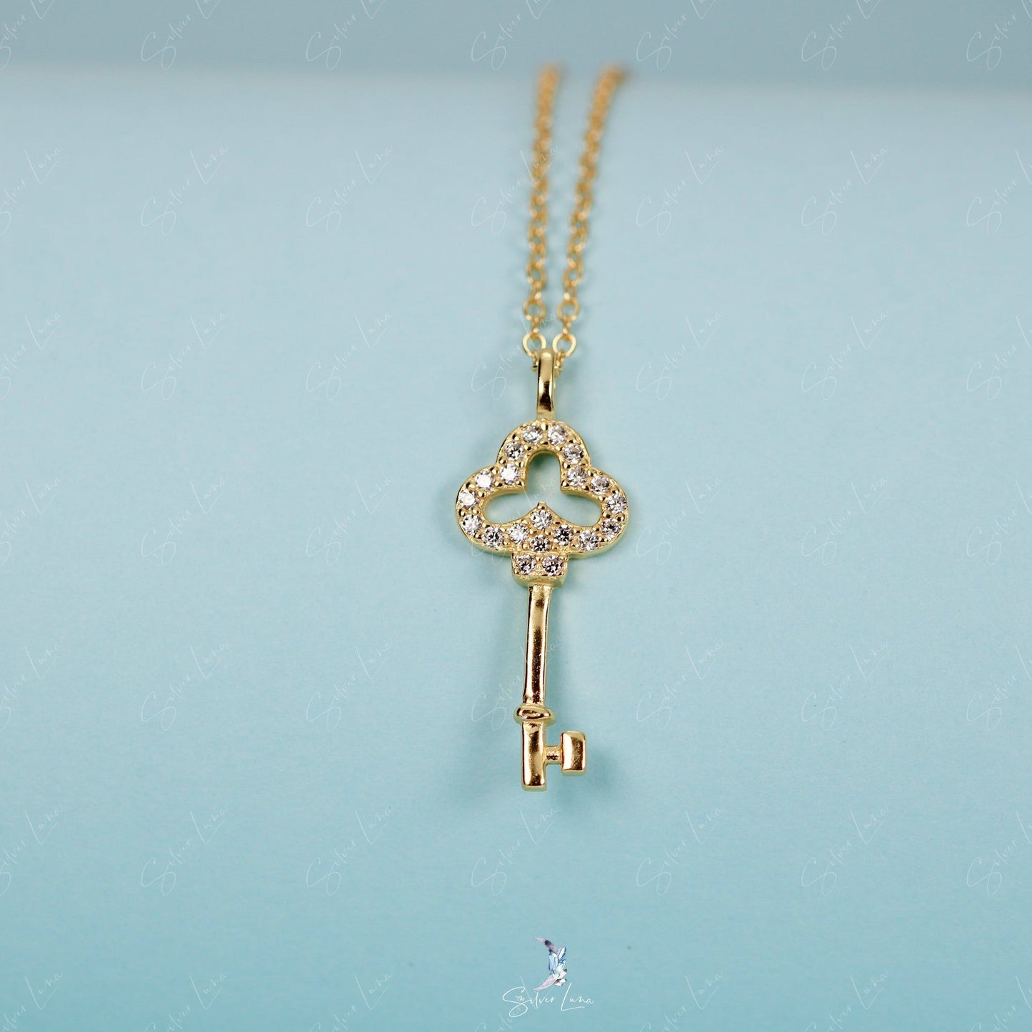 Dainty key pendant necklace in sterling silver