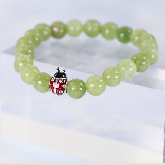 Ladybug bead charm green peridot beaded bracelet