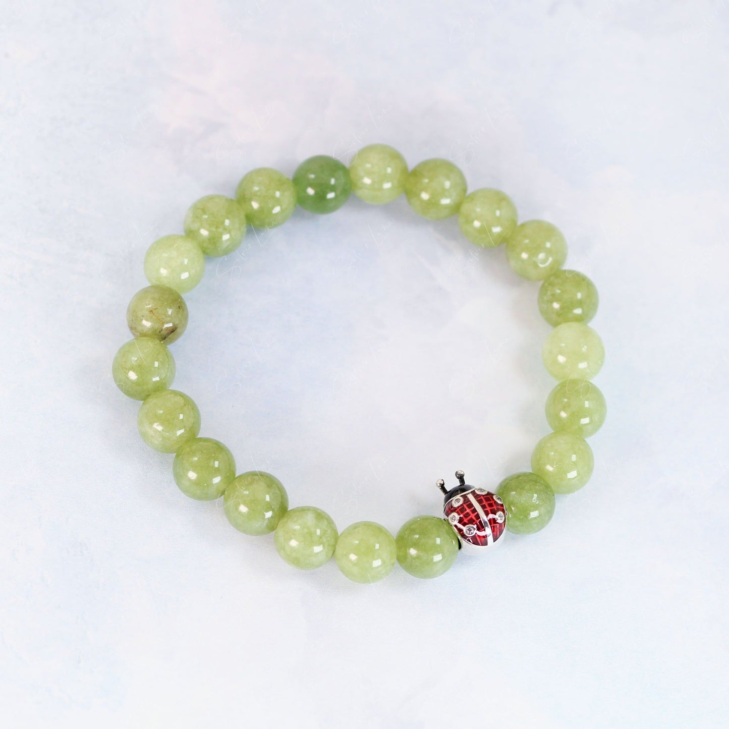 Ladybug bead charm green peridot beaded bracelet