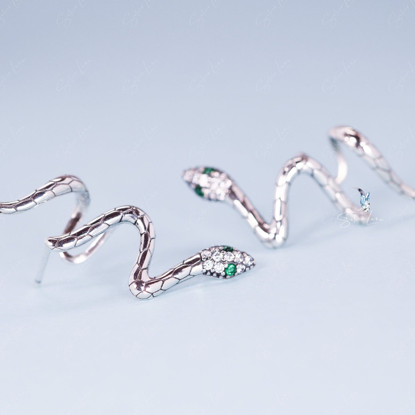Snake wrap with green eyes stud earrings