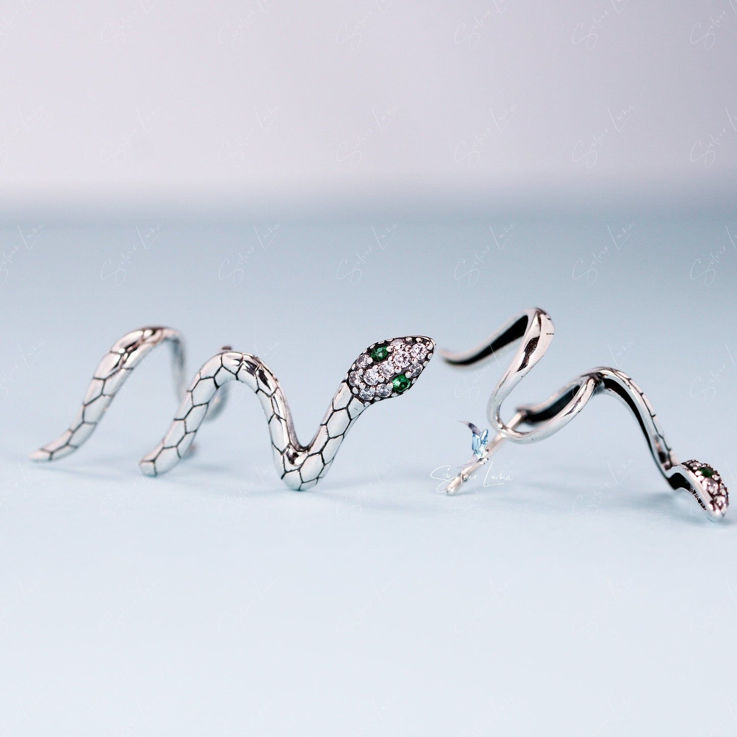 Snake wrap with green eyes stud earrings