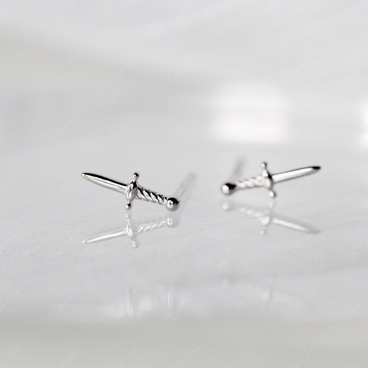 Tiny sword dagger sterling silver stud earrings