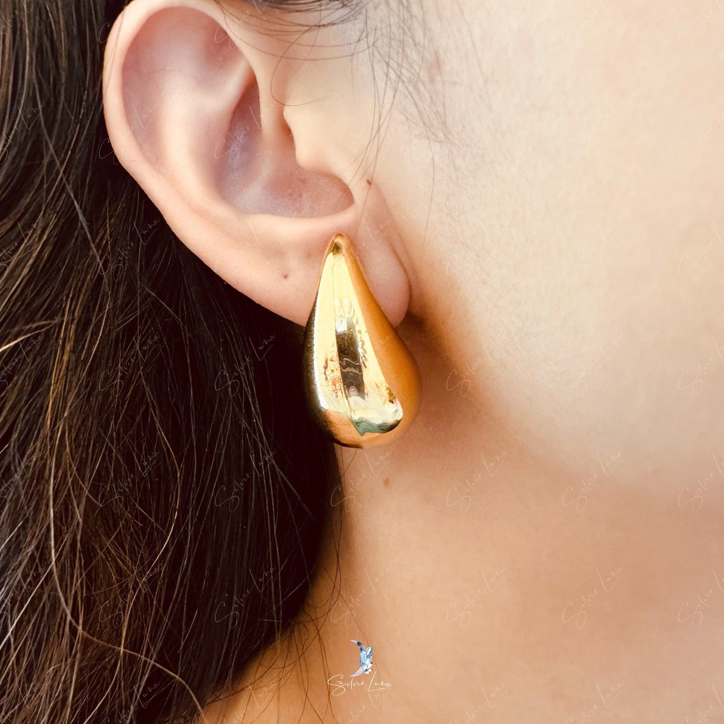 Golden water drop stud earrings