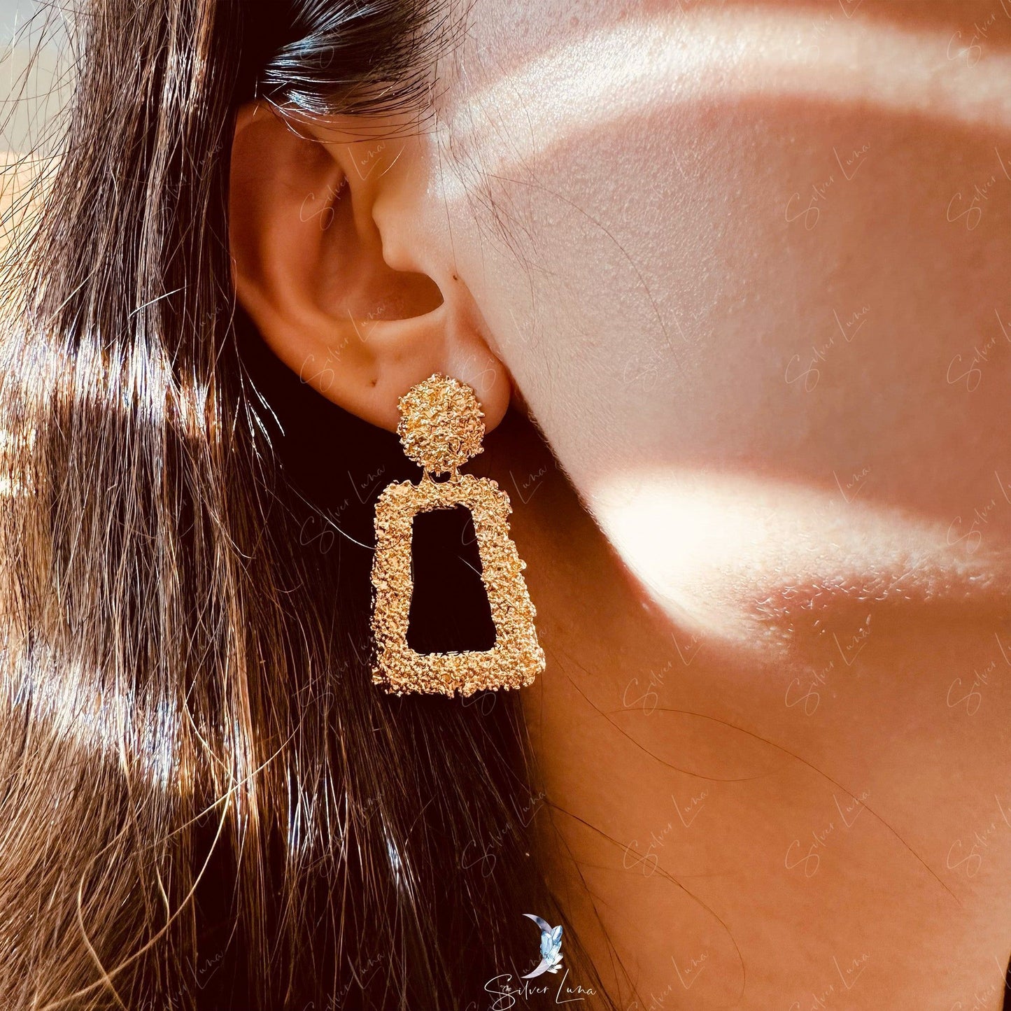 Golden textured metal statement earrings