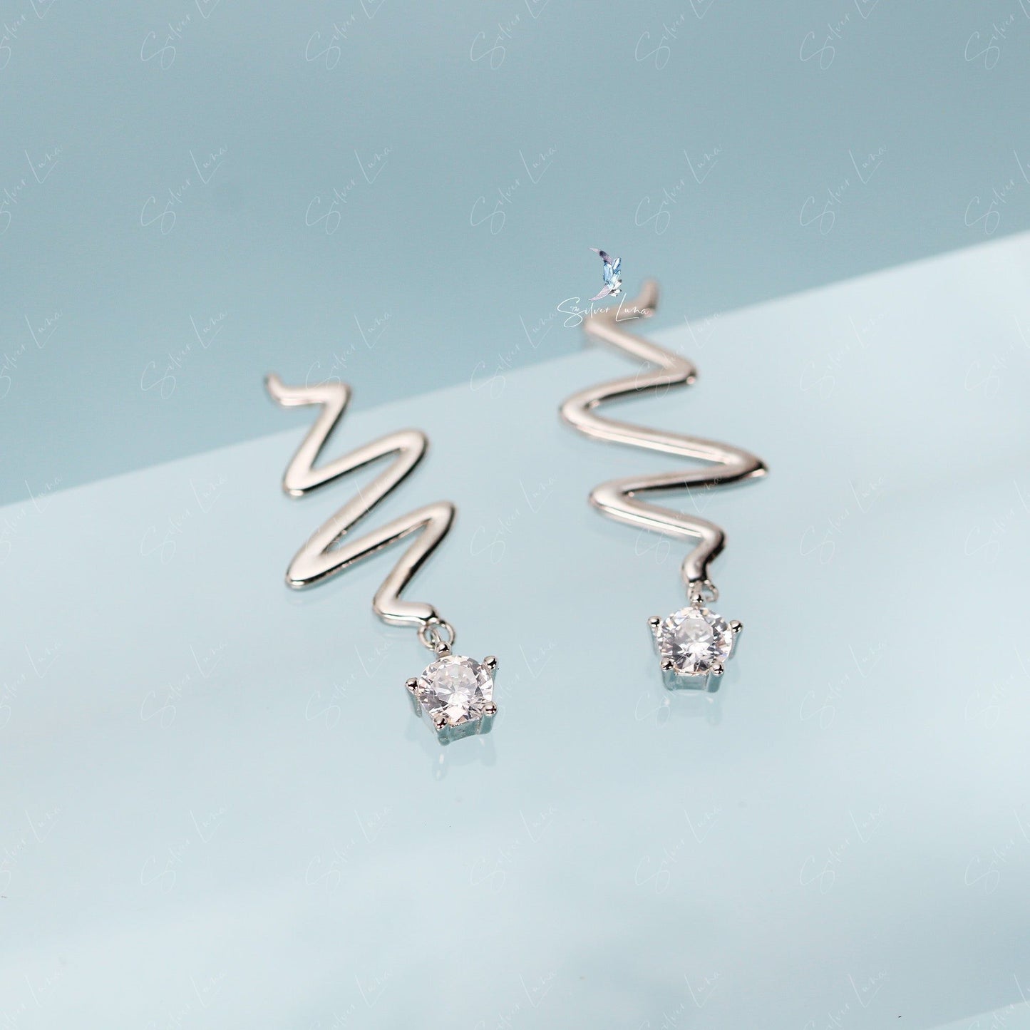 Wavy star drop sterling silver stud earrings