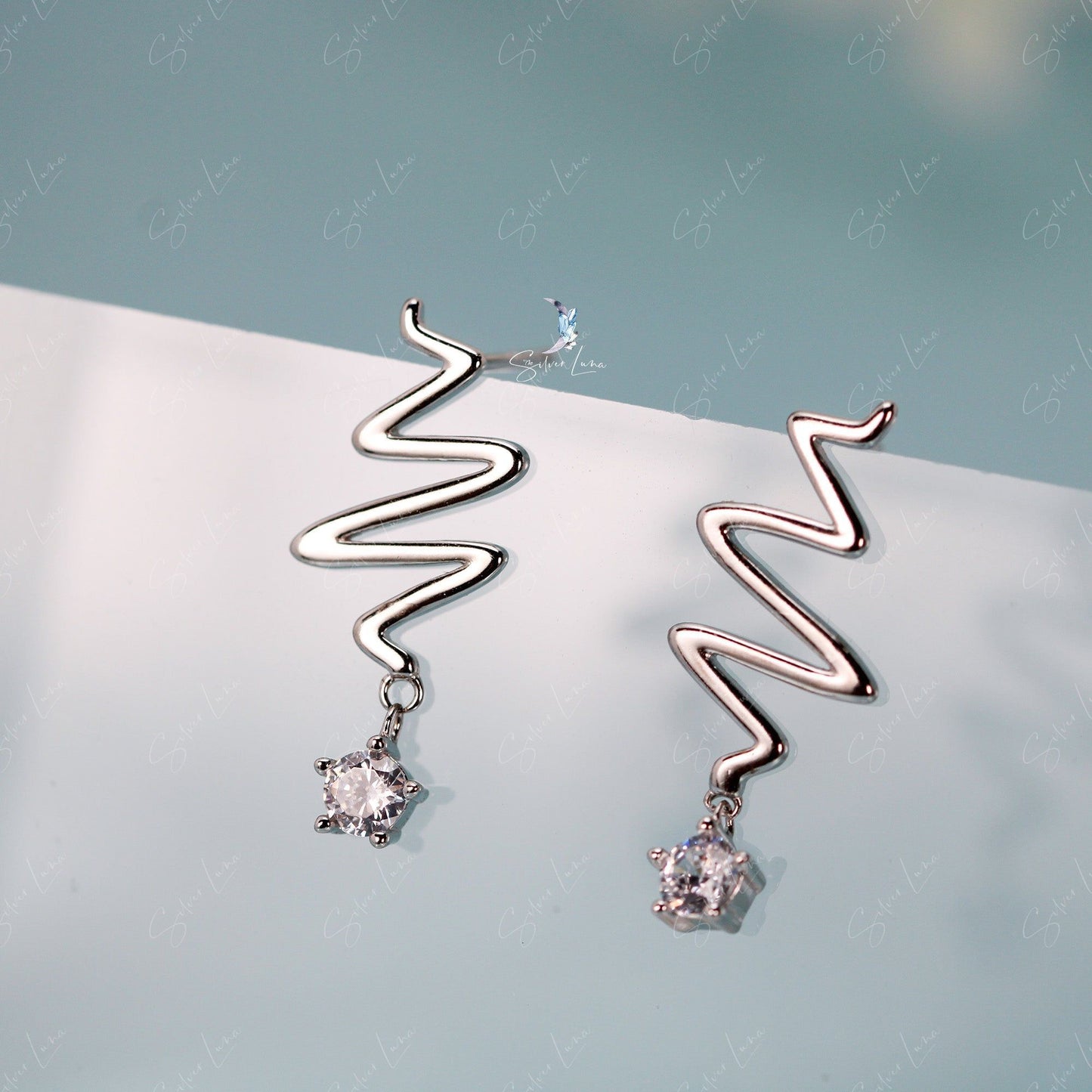 Wavy star drop sterling silver stud earrings