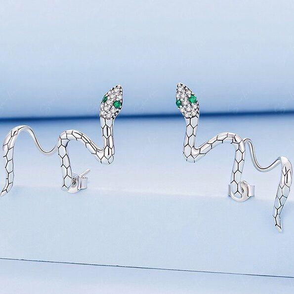 Snake wrap with green eyes stud earrings