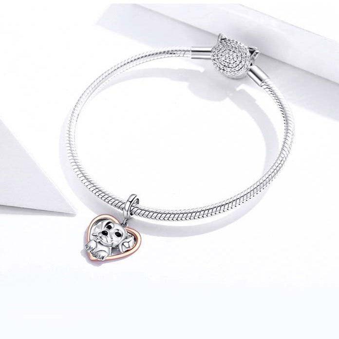 dog with heart dangle charm