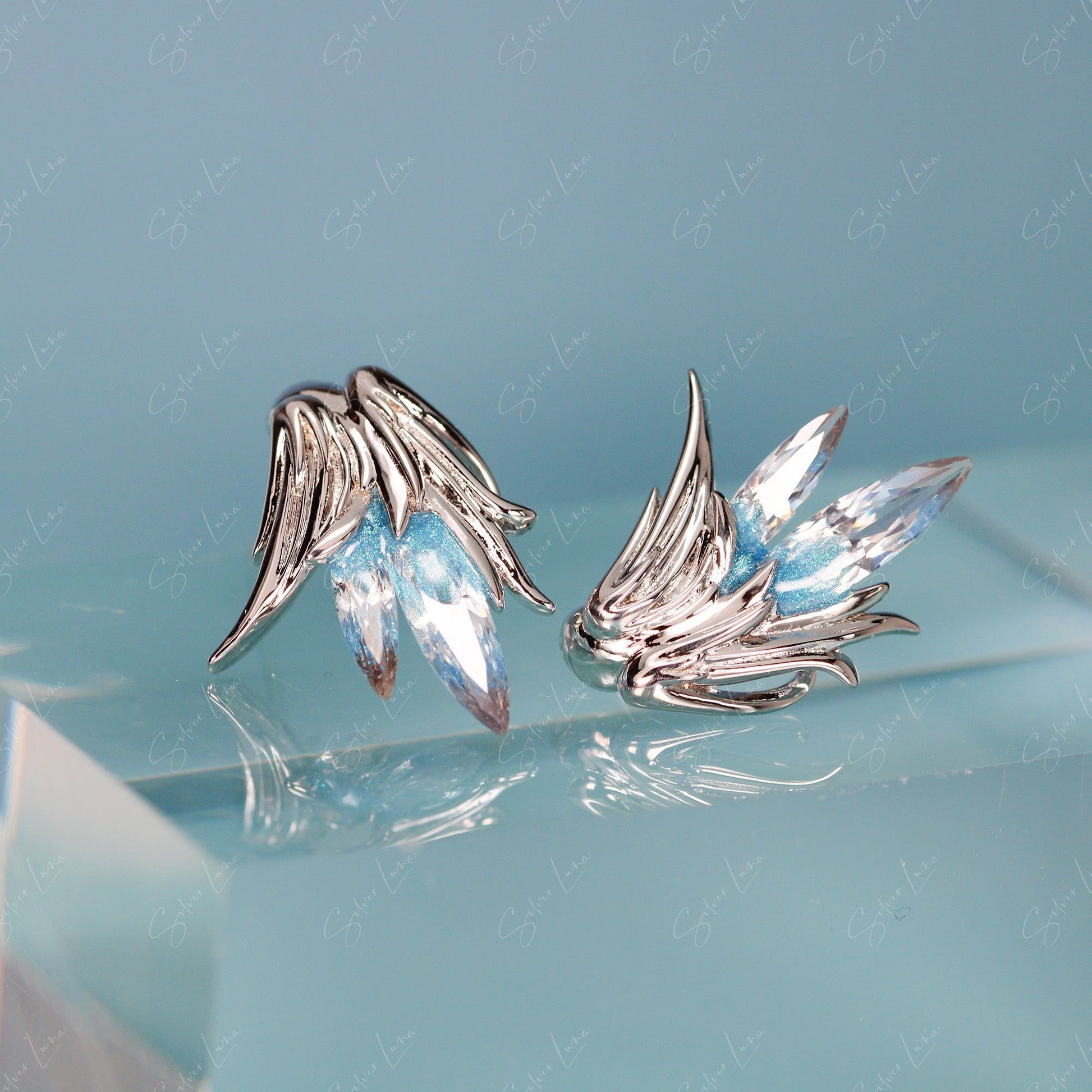 bird feather stud earrings