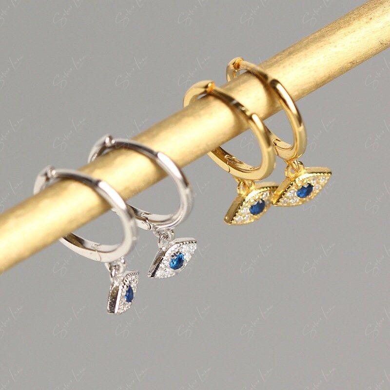 silver evil eye hoop earrings