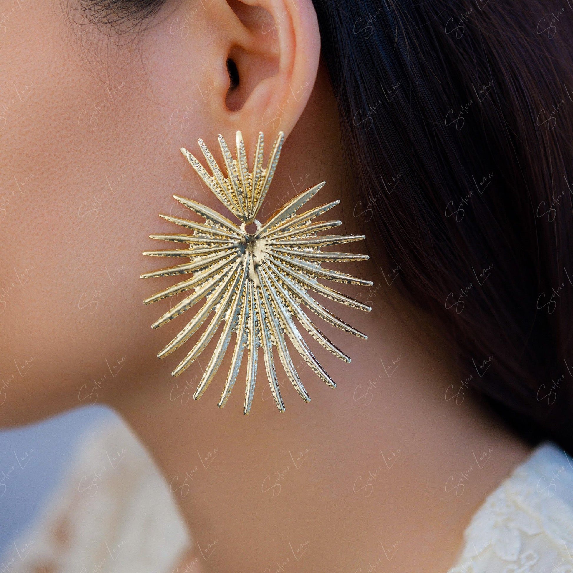 metal coconut leaf statement earrings