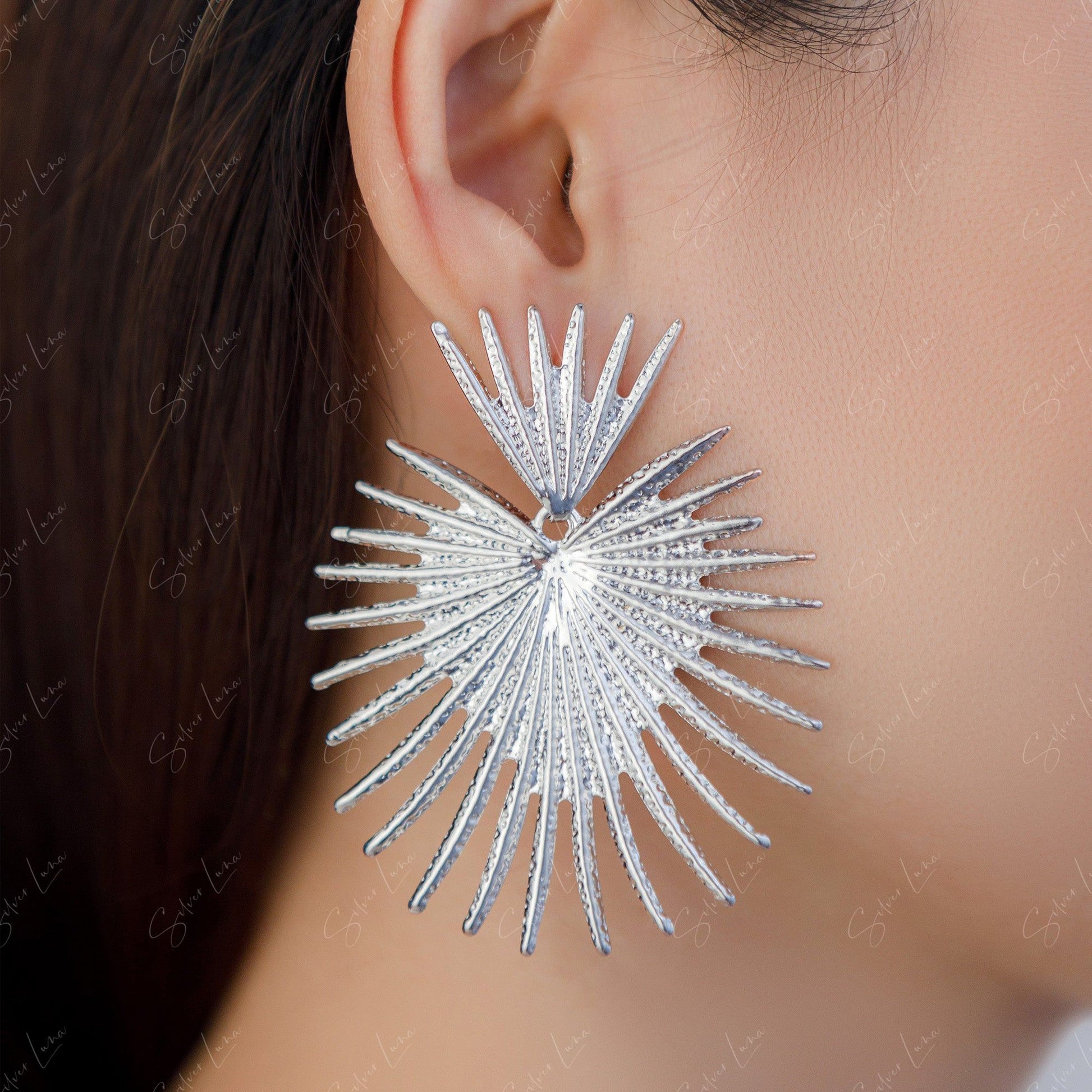 metal coconut leaf statement earrings