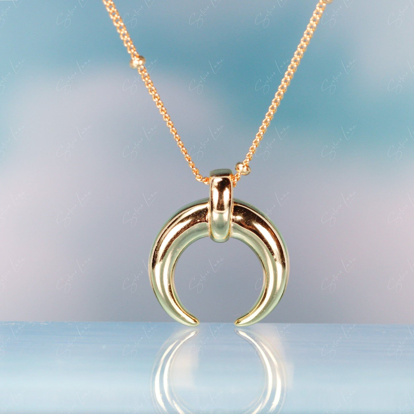 Golden crescent moon pendant necklace