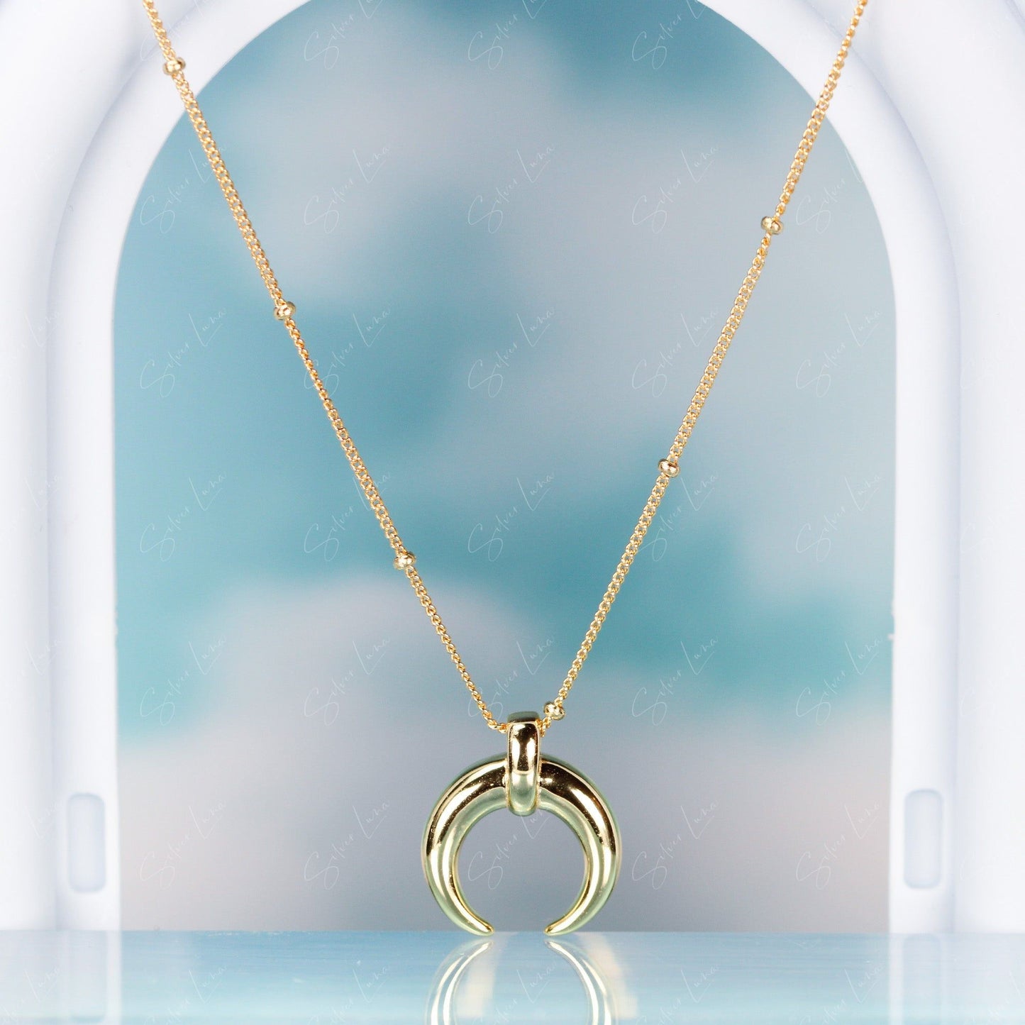 Golden crescent moon pendant necklace