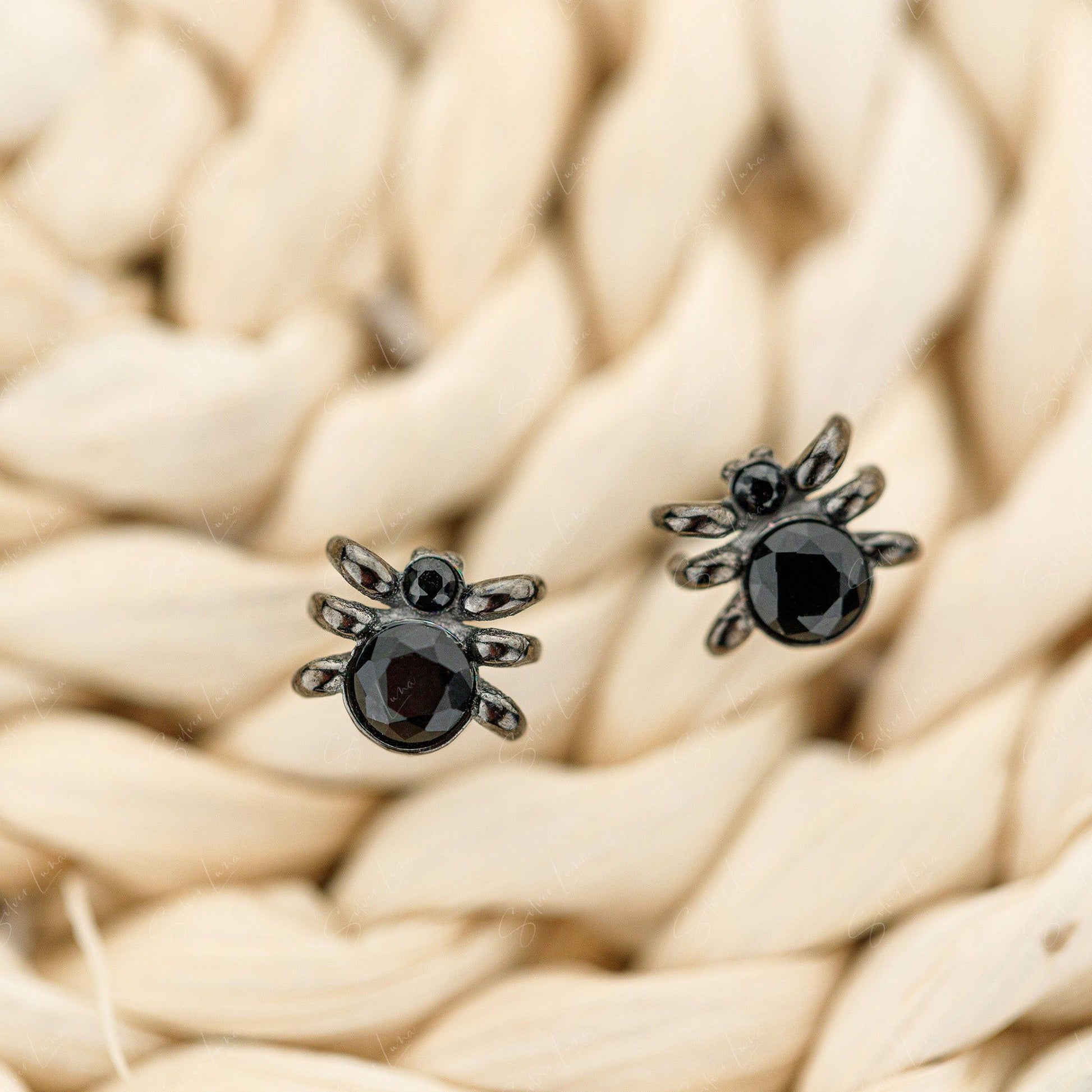 black spider stud earrings