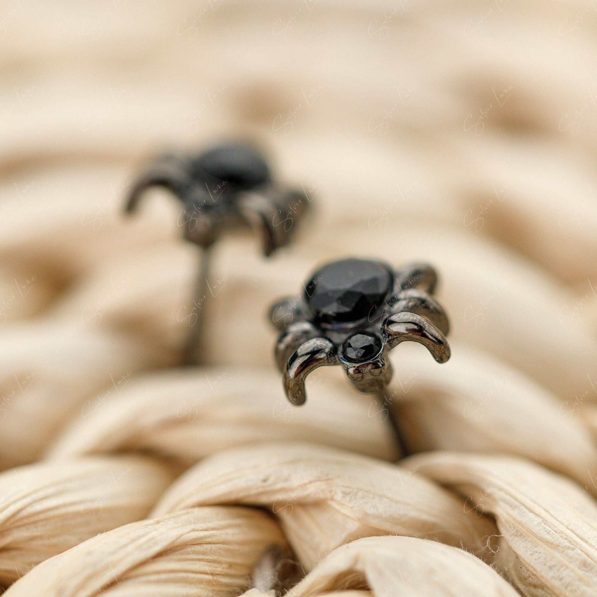 black spider stud earrings