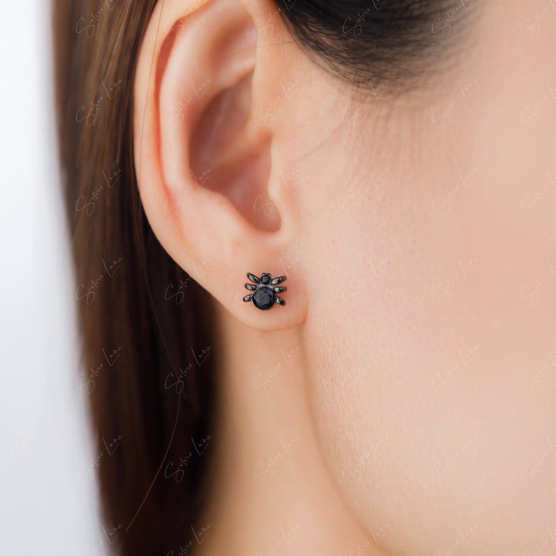 black spider stud earrings