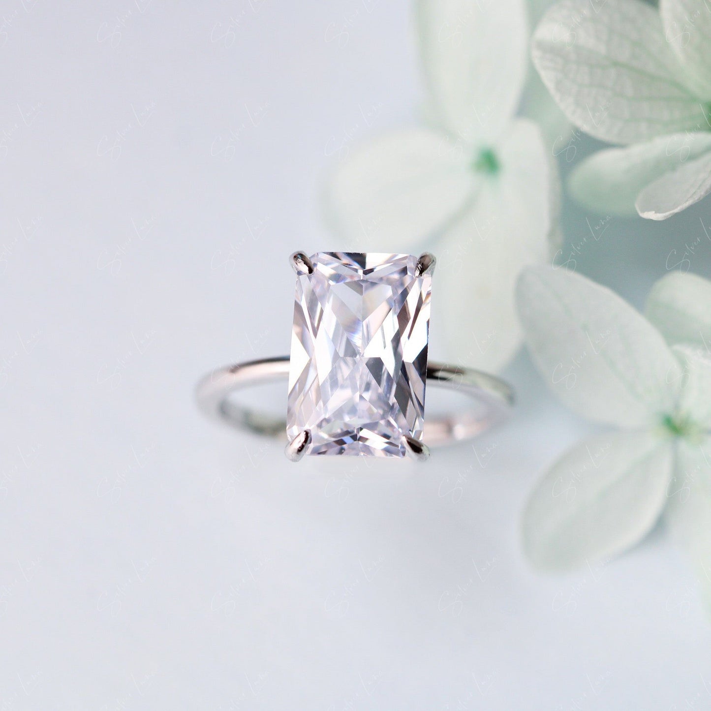 Radiant rectangle cubic zirconia engagement ring