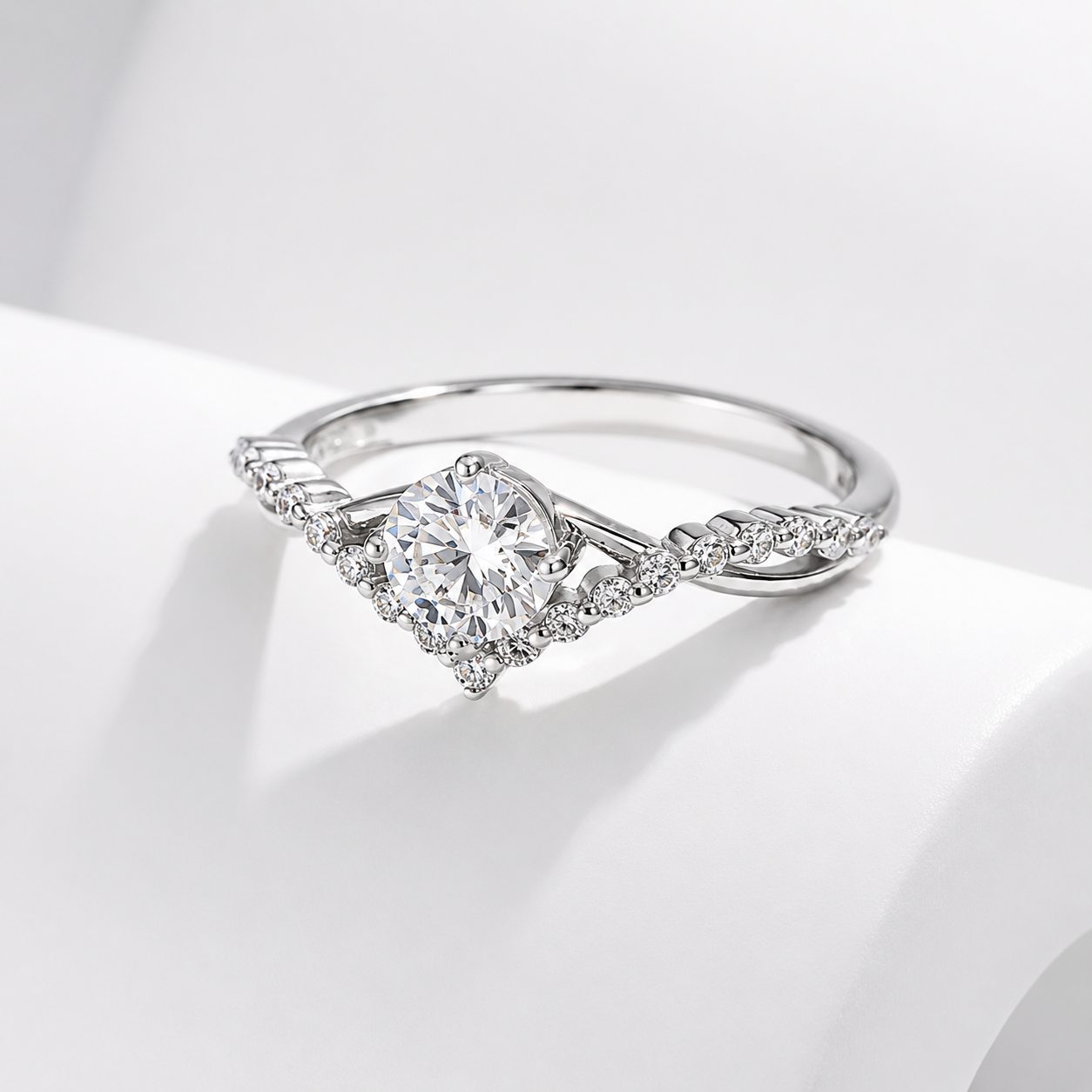 Silver ring with a diamond on a light gray background
