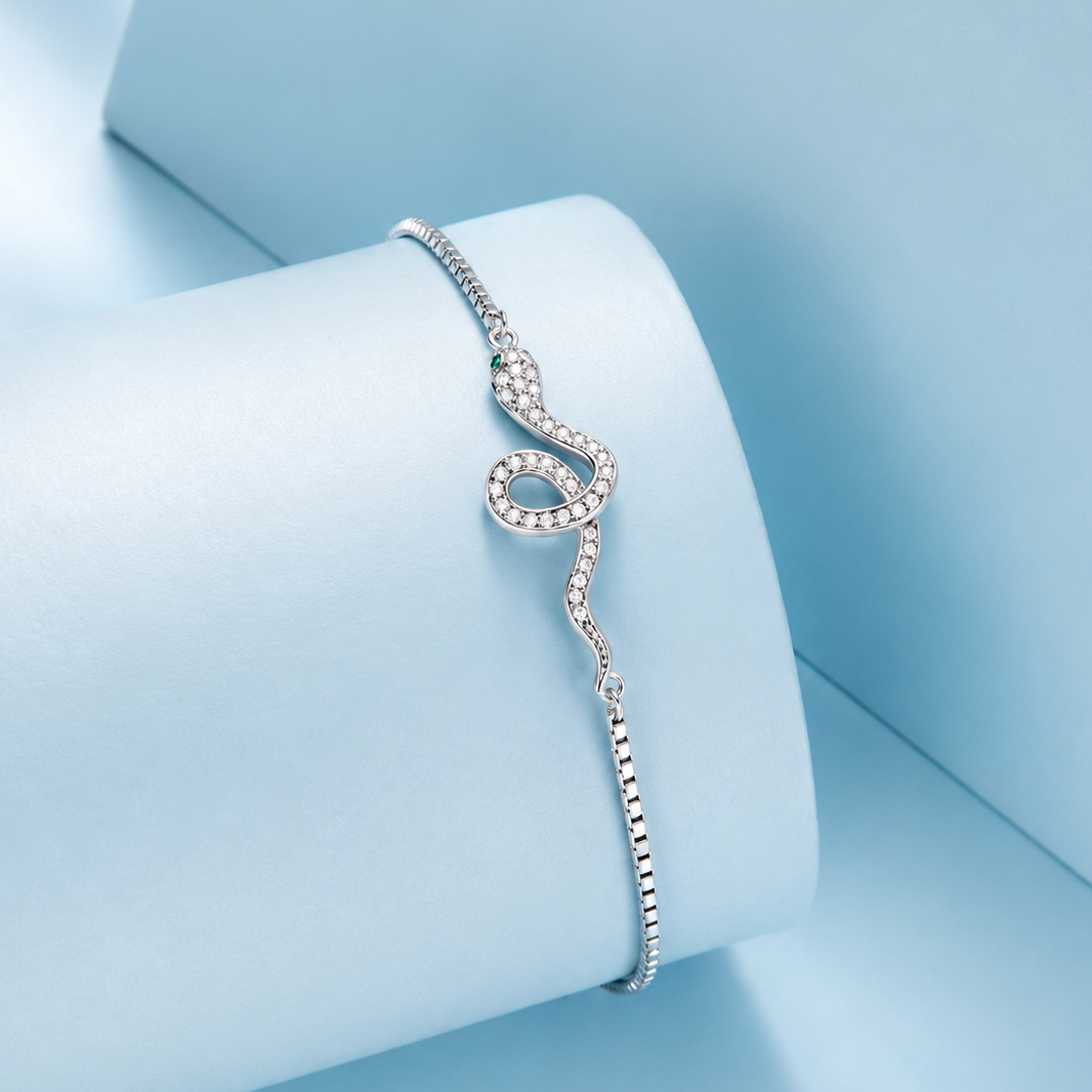 Silver bracelet with a unique design on a light blue background