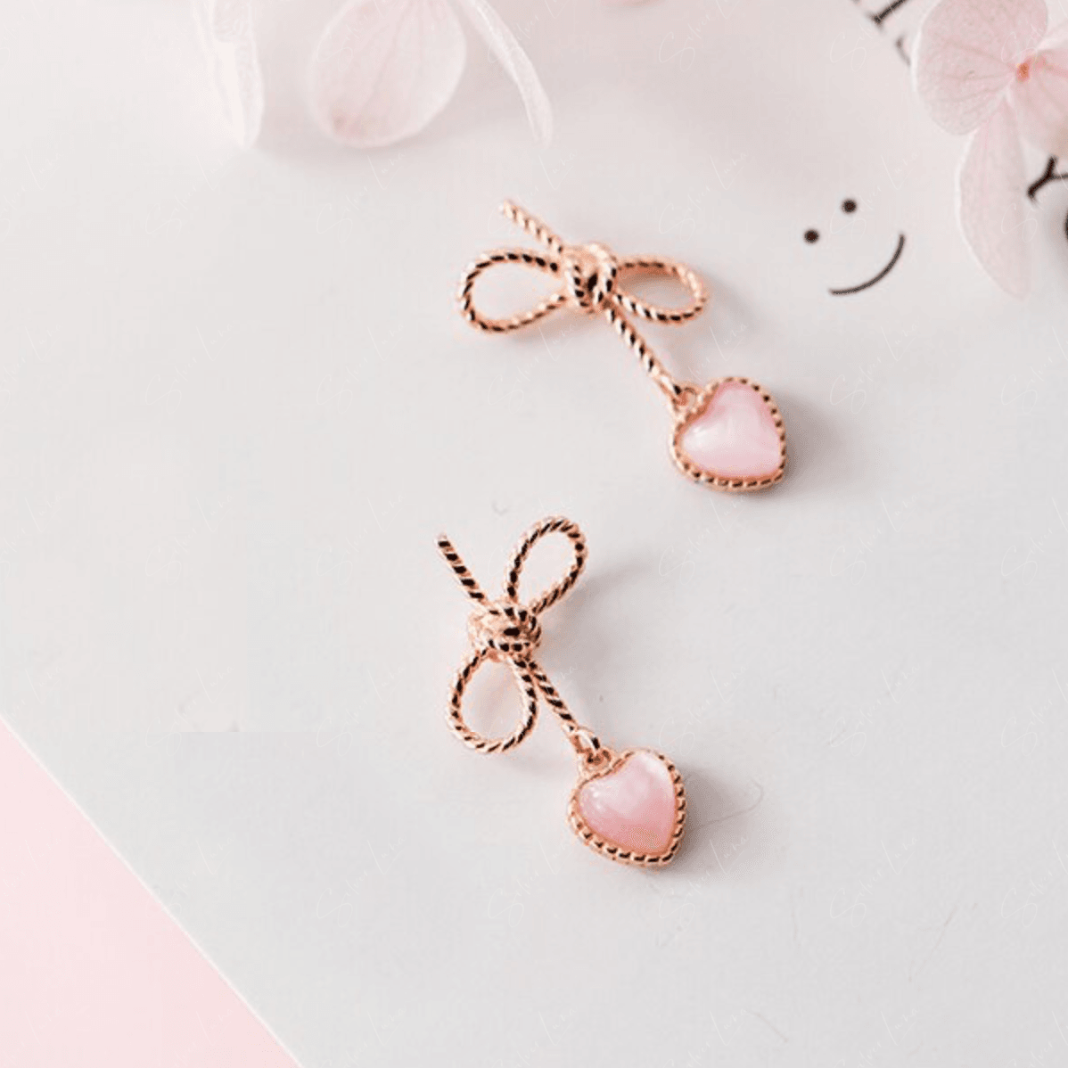 Rose gold bowtie heart drop sterling silver earrings