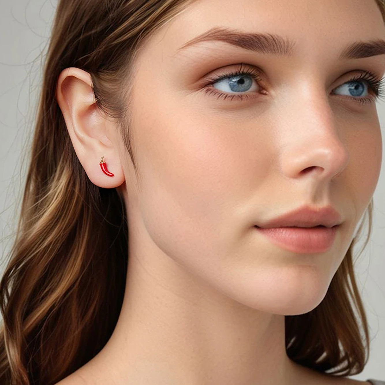 Close-up of a woman's face with a neutral background