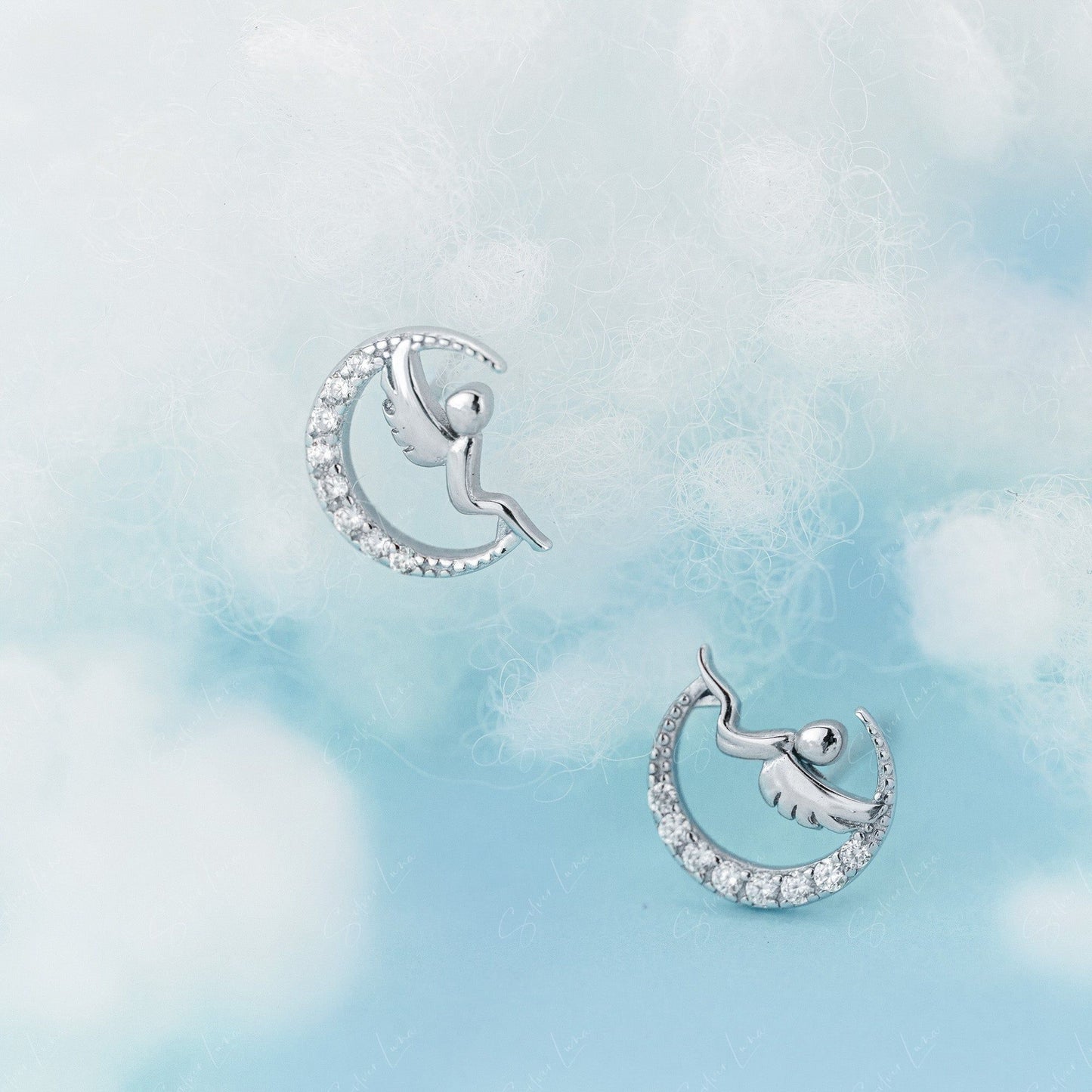 angel on moon stud earrings