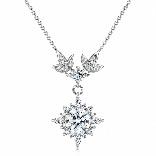 Moisanite necklace with leaf and star-shaped pendants on a white background