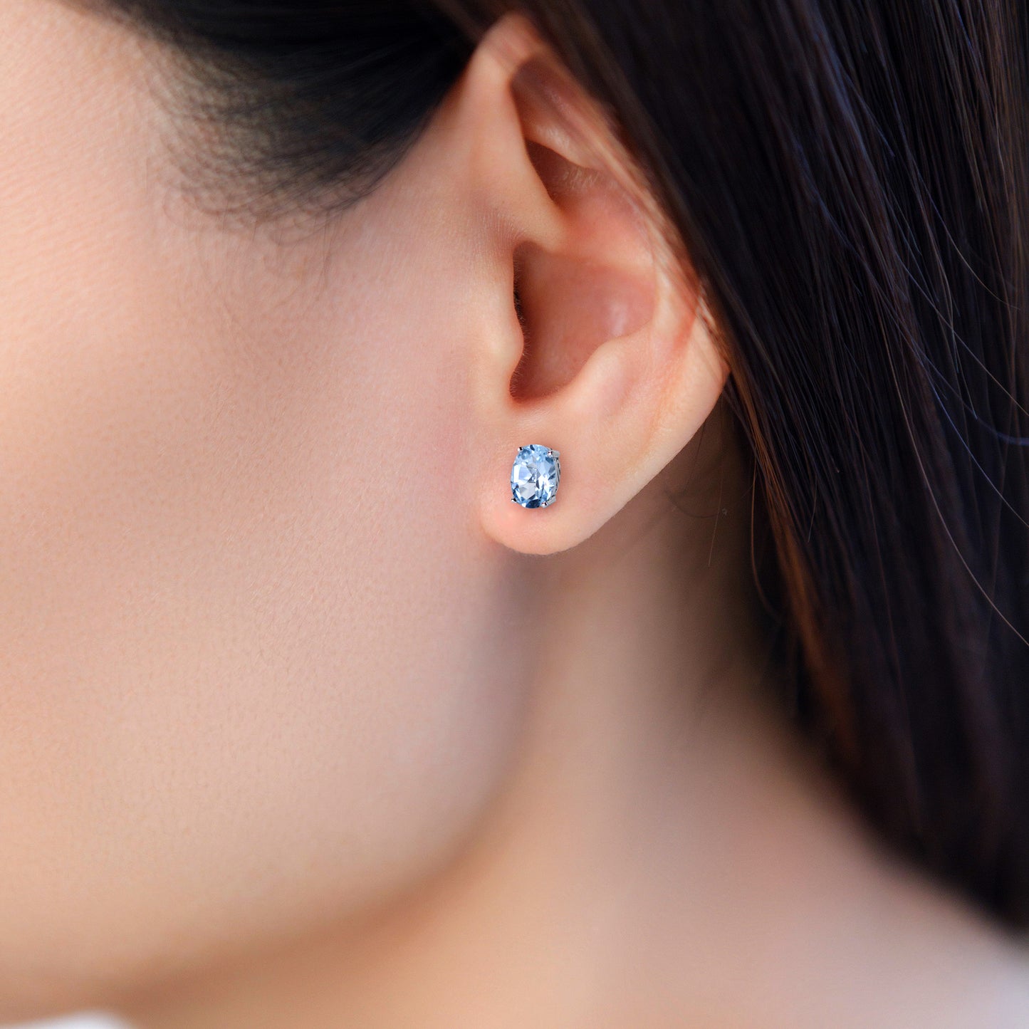 Oval blue topaz stud earrings