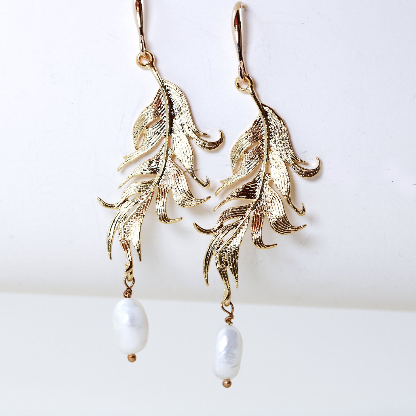 golden feather pearl drop earrings