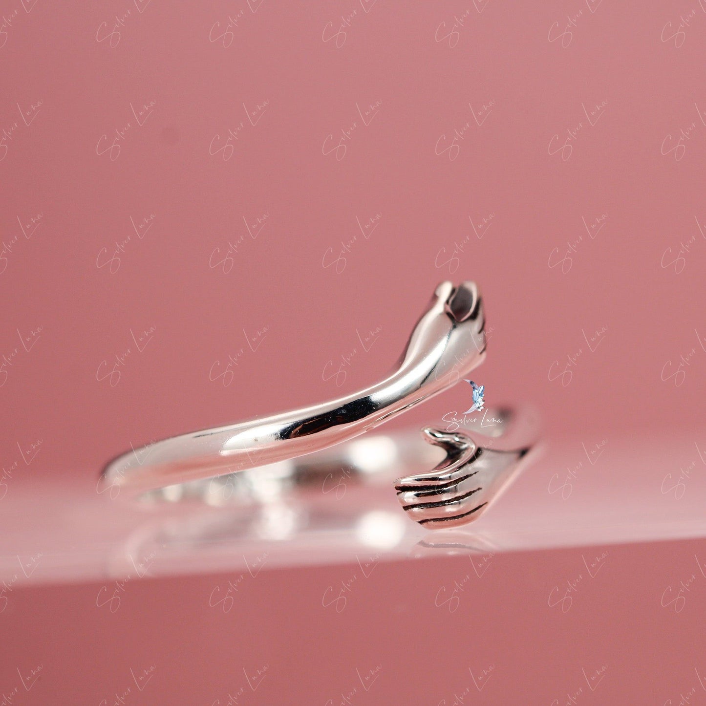 Hugging hand wrap adjustable ring