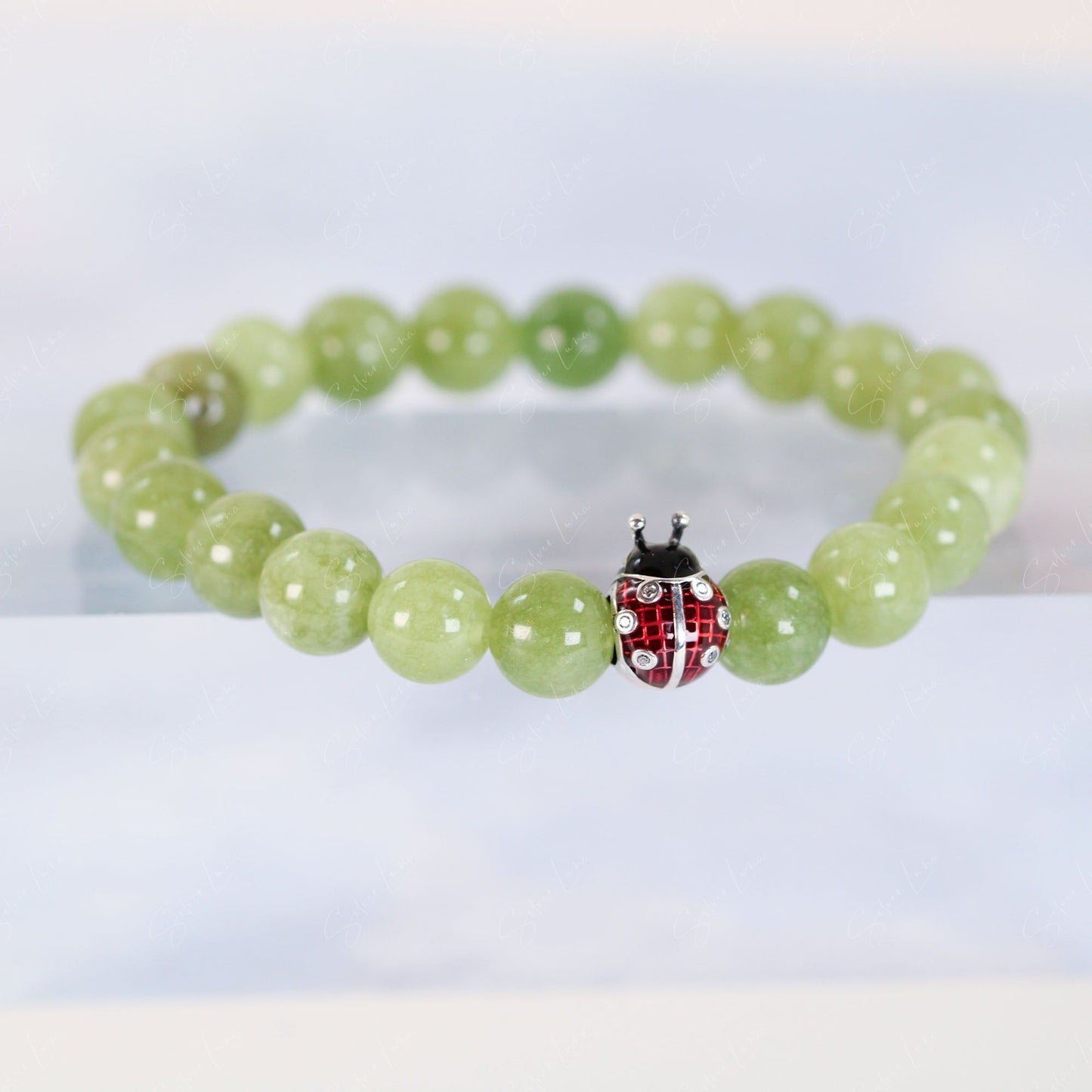 Ladybug bead charm green peridot beaded bracelet