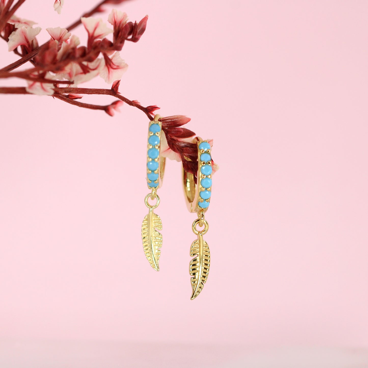 Gold plated blue cubic zirconias leaf hoop earrings