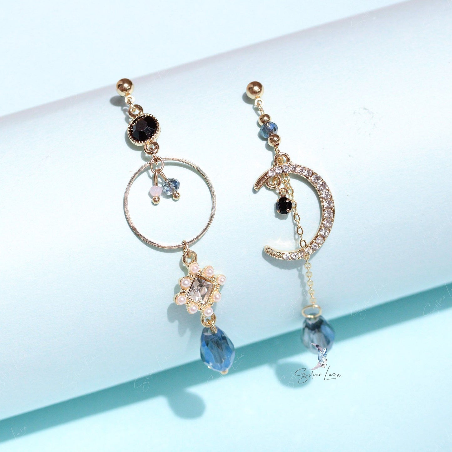 Long shiny crystal moon dangle drop earrings