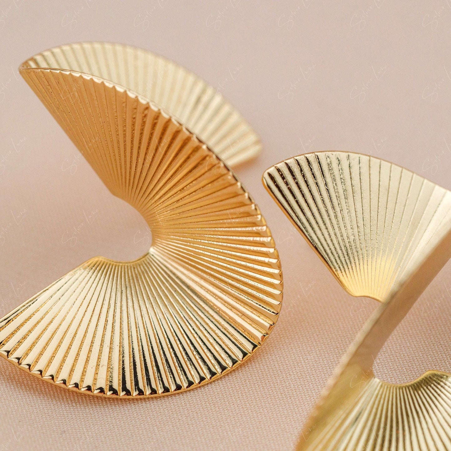 Gold metal abstract statement earrings