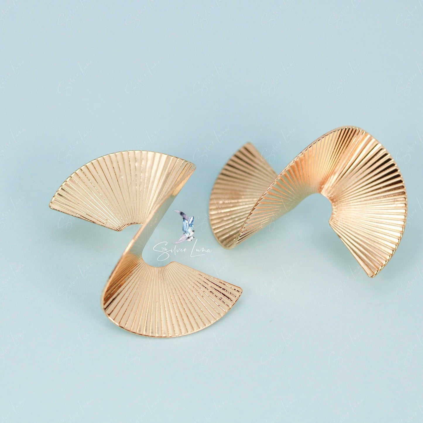 Gold metal abstract statement earrings