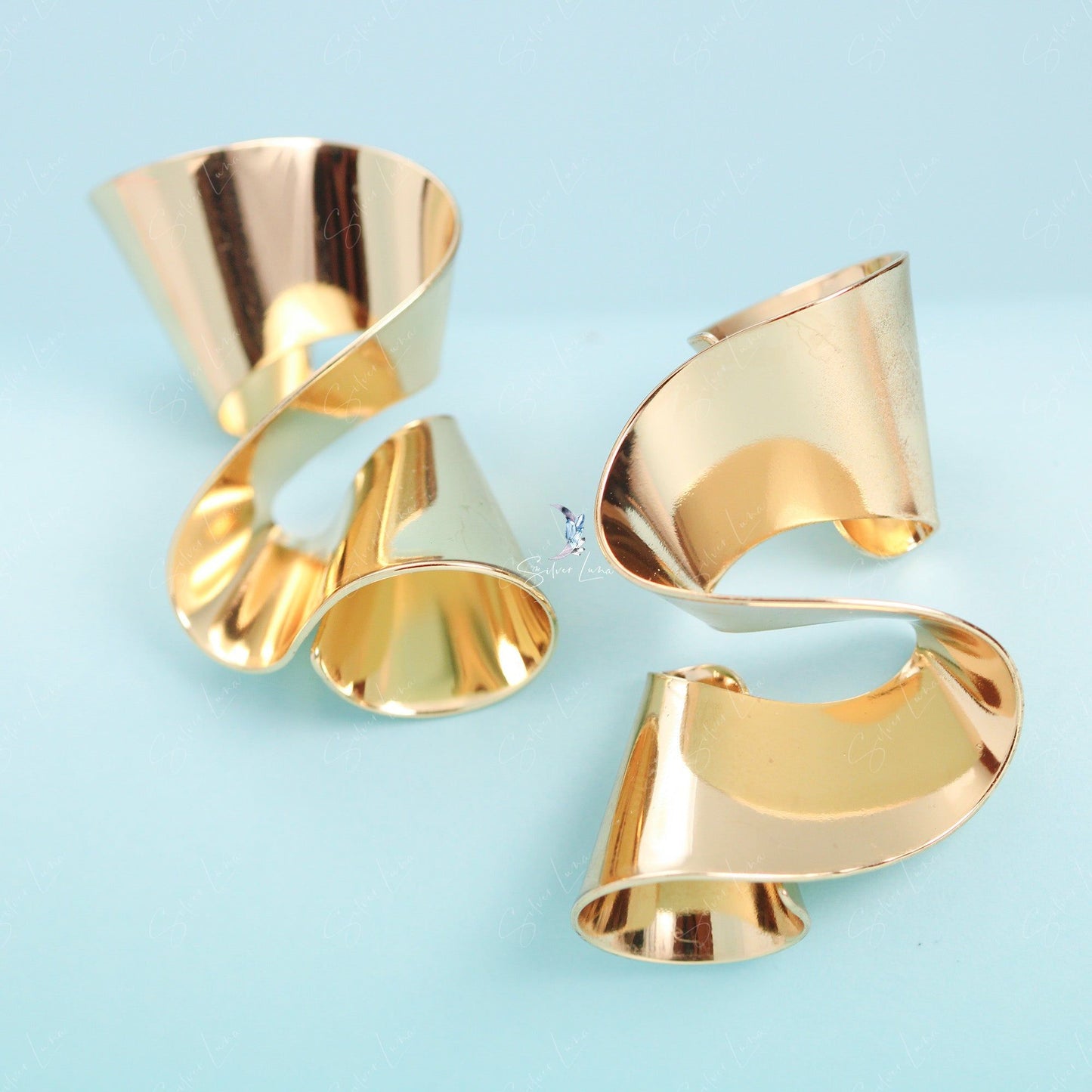 Pencil shave wave statement earrings