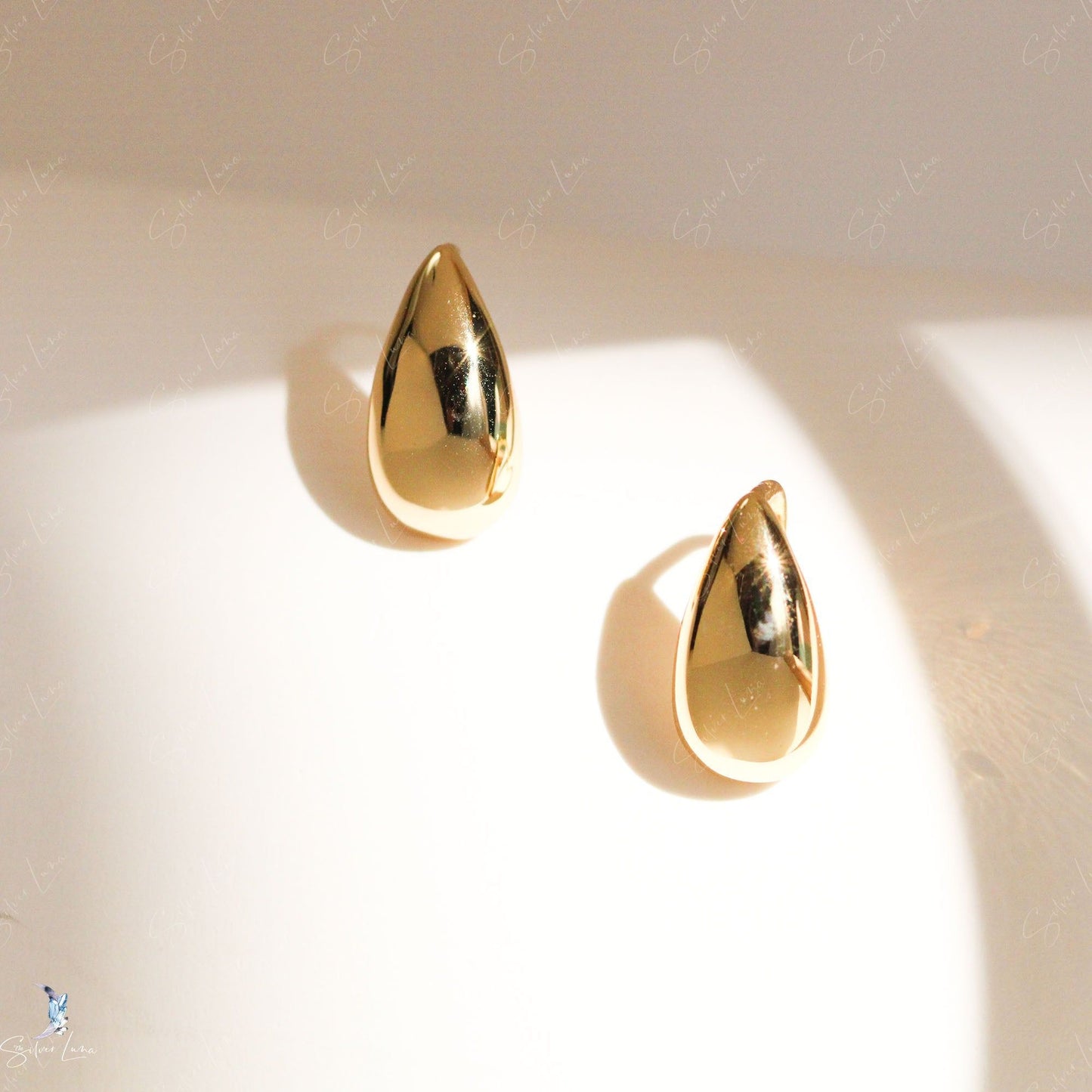 golden teardrop stud earrings