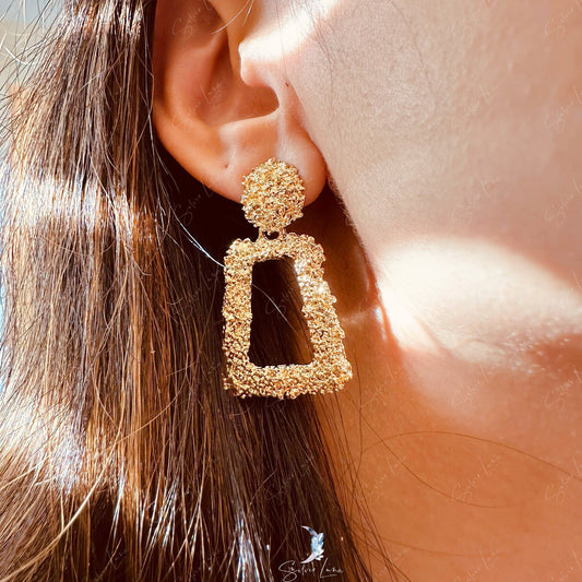 Golden textured metal statement earrings