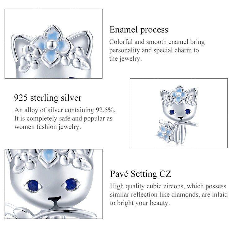 Cat holding blue flower sterling silver charm