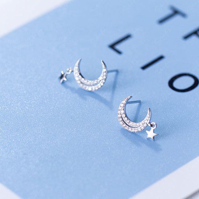 Crescent moon stud earrings with tiny star dangle drop