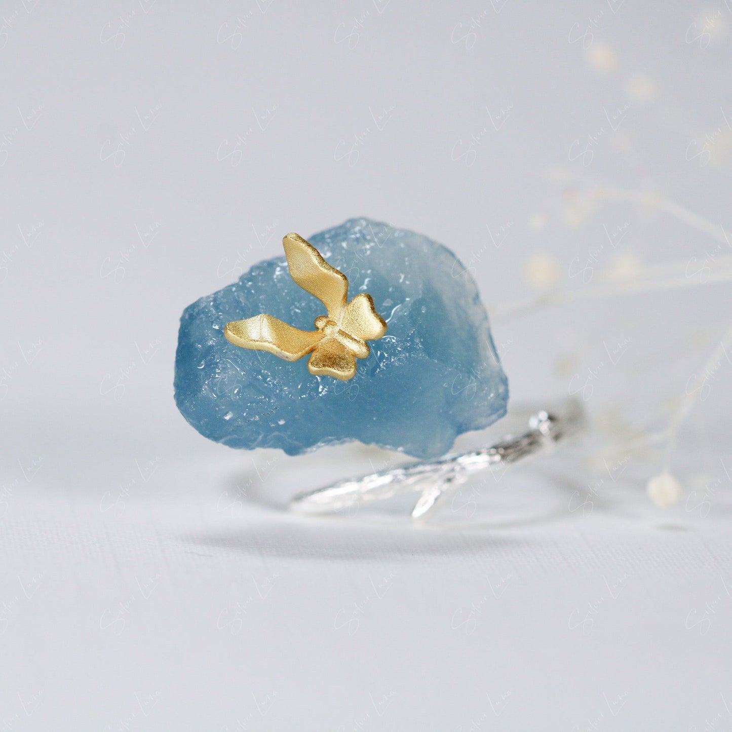 Butterfly on aquamarine ring