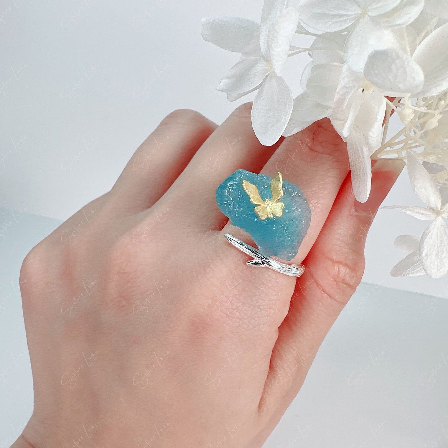 Butterfly on aquamarine ring