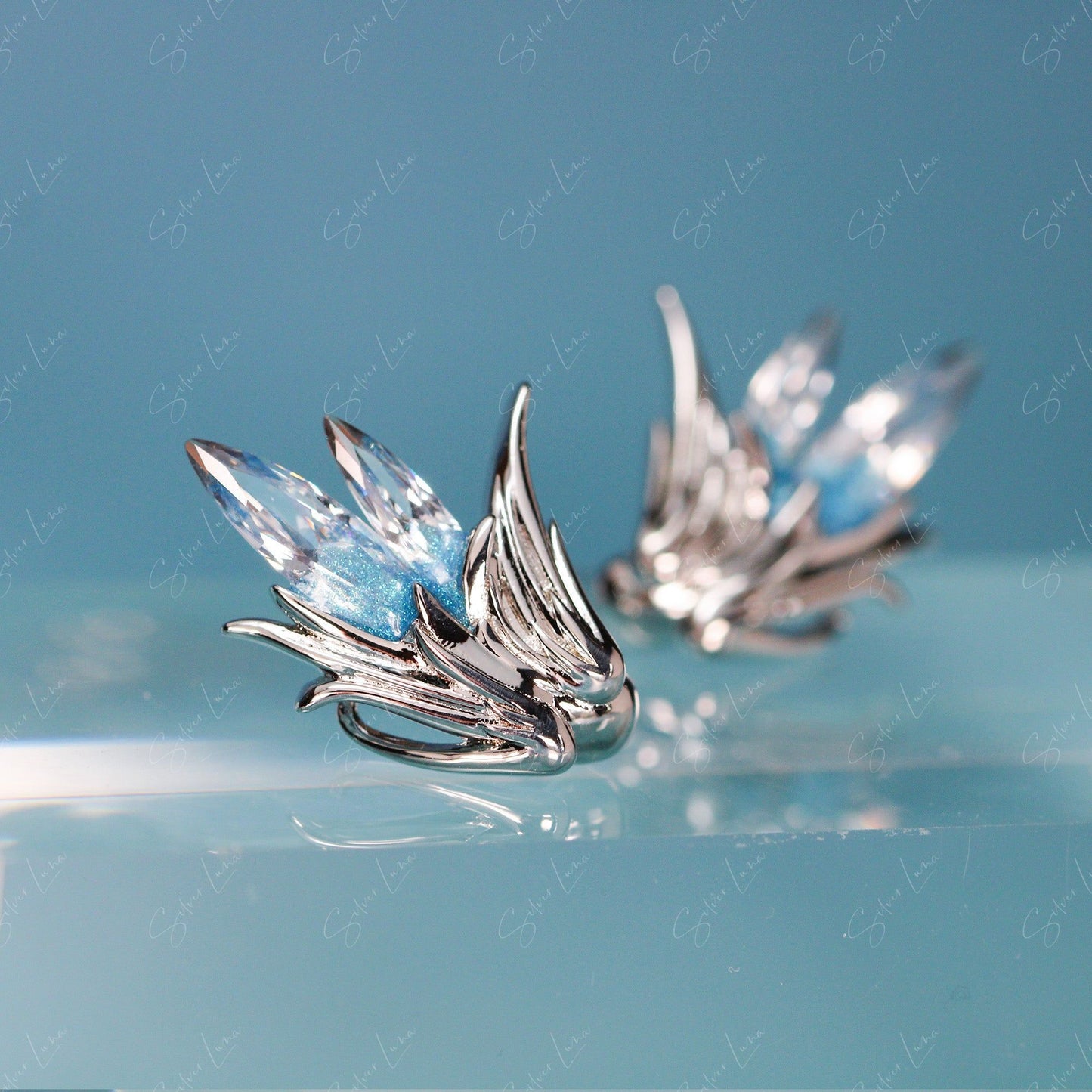 blue crystal feather earrings